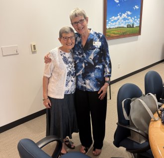 Helen Eleades Magas with Dean Smith
