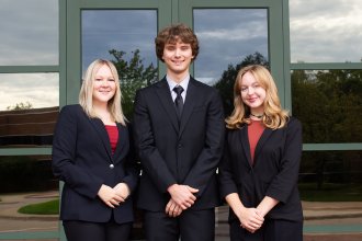 Alex Little, Isaac Madalinski and Katie Pozar outside the Haworth College of Business