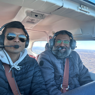 Student pilot and father in plane.