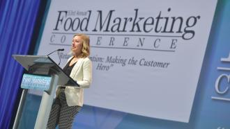 Erika Hejl standing at podium