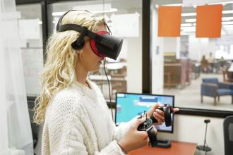 Nursing student Claire Baker participates in a virtual reality experience at Waldo Library. The VR lab gives students a chance to test the technology.