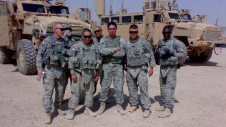 Rooney with other soldiers