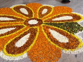 A flower made by Indian ingredients on the ground