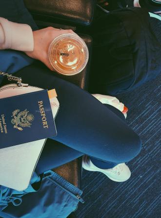 Passport, cup of coffee, sitting in the airport