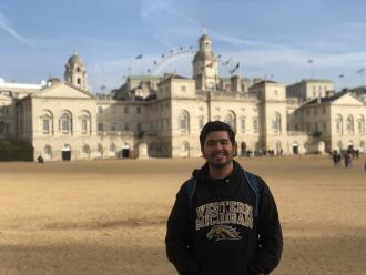 Poi Tavares standing in front of the Horse Guards in London while wearing a Western Michigan sweatshirt