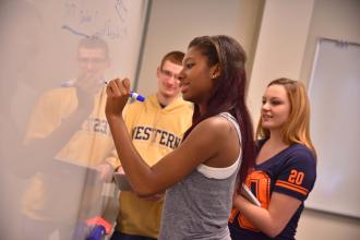 Students at a white board
