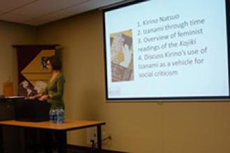 Rebecca Copeland presenting at conference.