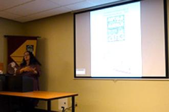 Laura Miller presenting at conference.