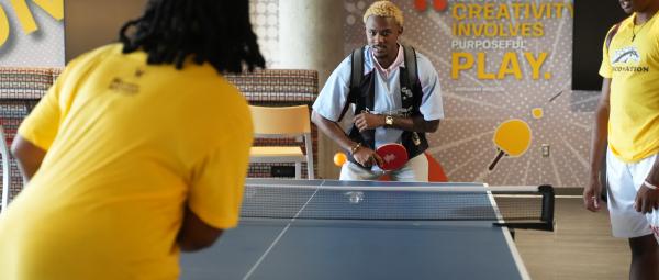 Students playing ping pong in the WMU Student Center