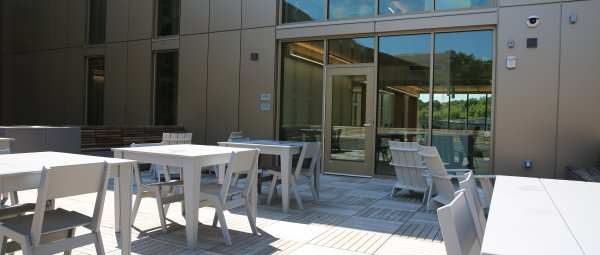Modern outdoor seating in a Valley Oaks residence hall courtyard.