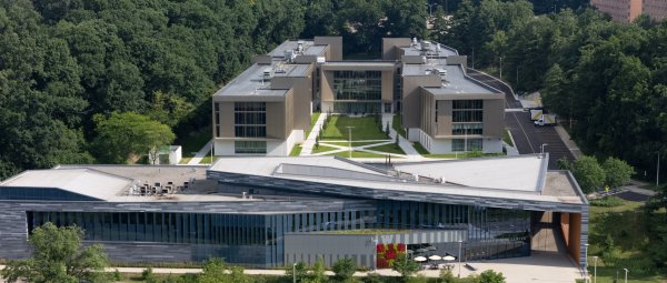 An aerial view of the Valley Dining Center and Valley Oaks residence hall surrounded by trees.