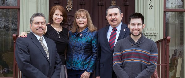 Flores family standing outside Oaklands