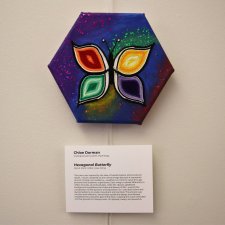 Pencil, paint, glitter, glue and string art titled "Hexagonal Butterfly."