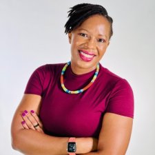 Professional photo of Malitsitso Moteane in a burgundy top with her arms crossed