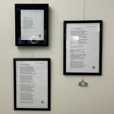 Three framed poems titled “Little love”, “Middle School Bug Project”, and “Cribbage was invented by a poet."