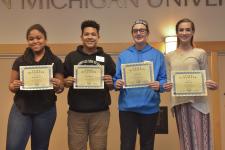 Four finalists from WMU History Day show their State Finals certificates